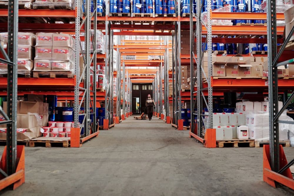 Distribution warehouse aisle with stocked racks